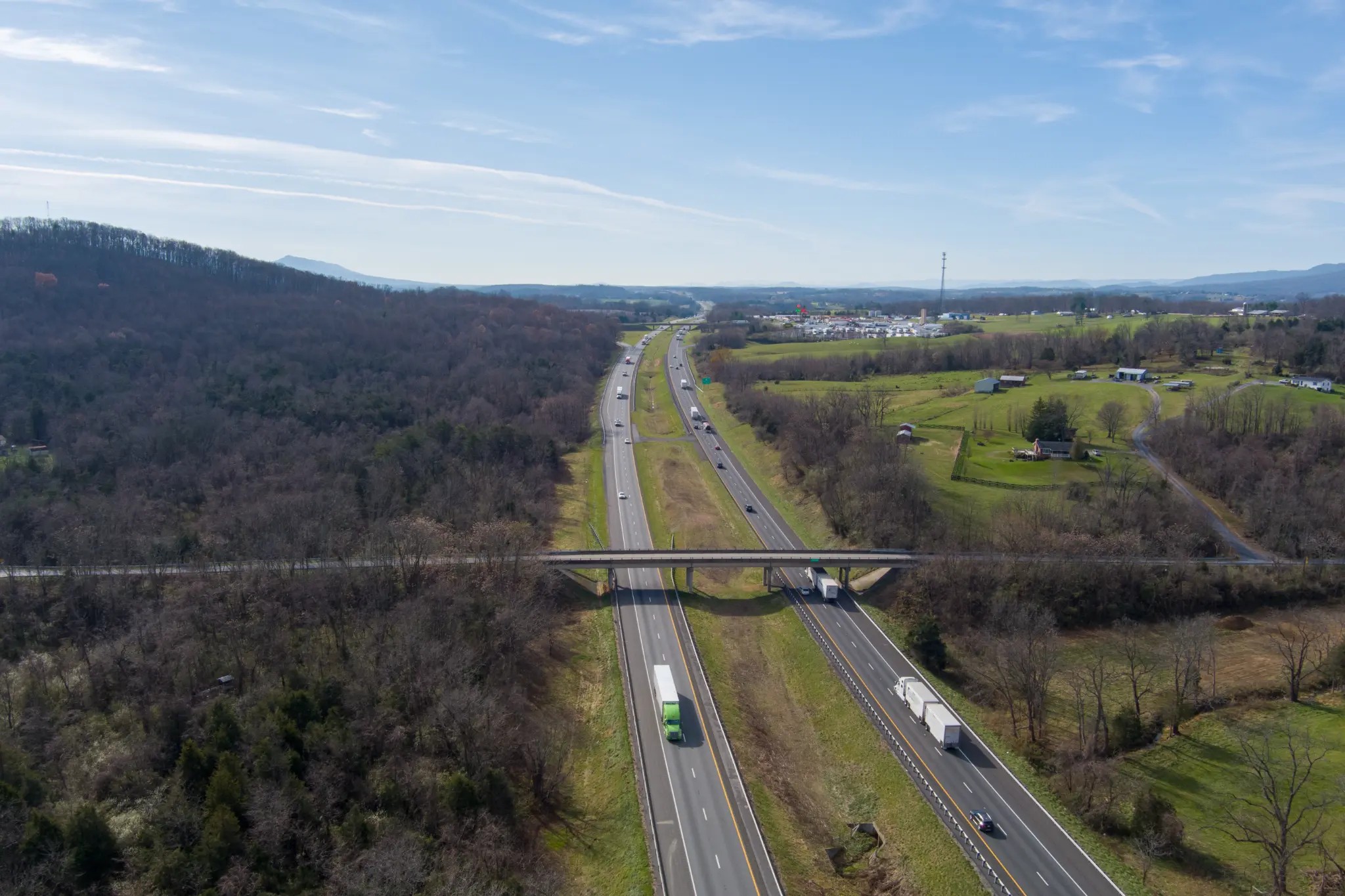 Aerial view of tractor-trailers and other traffic traveling on a Virginia highway
