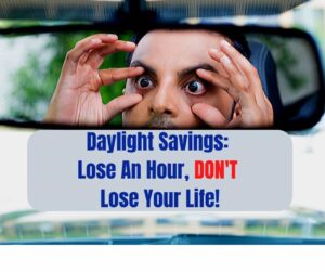 A person holding their eyes open while looking in their rear view mirror, trying to stay awake after losing an hour of sleep from daylight savings.
