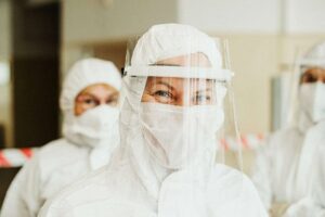 Several healthcare workers with their face shields, masks and other PPE during the COVID-19 outbreak.
