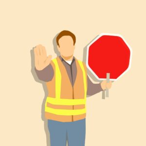 An animation of a highway worker holding out their hand and holding up a stop sign in high visibility attire.