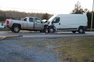 2 cars in head on collision