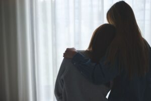 mom hugging child